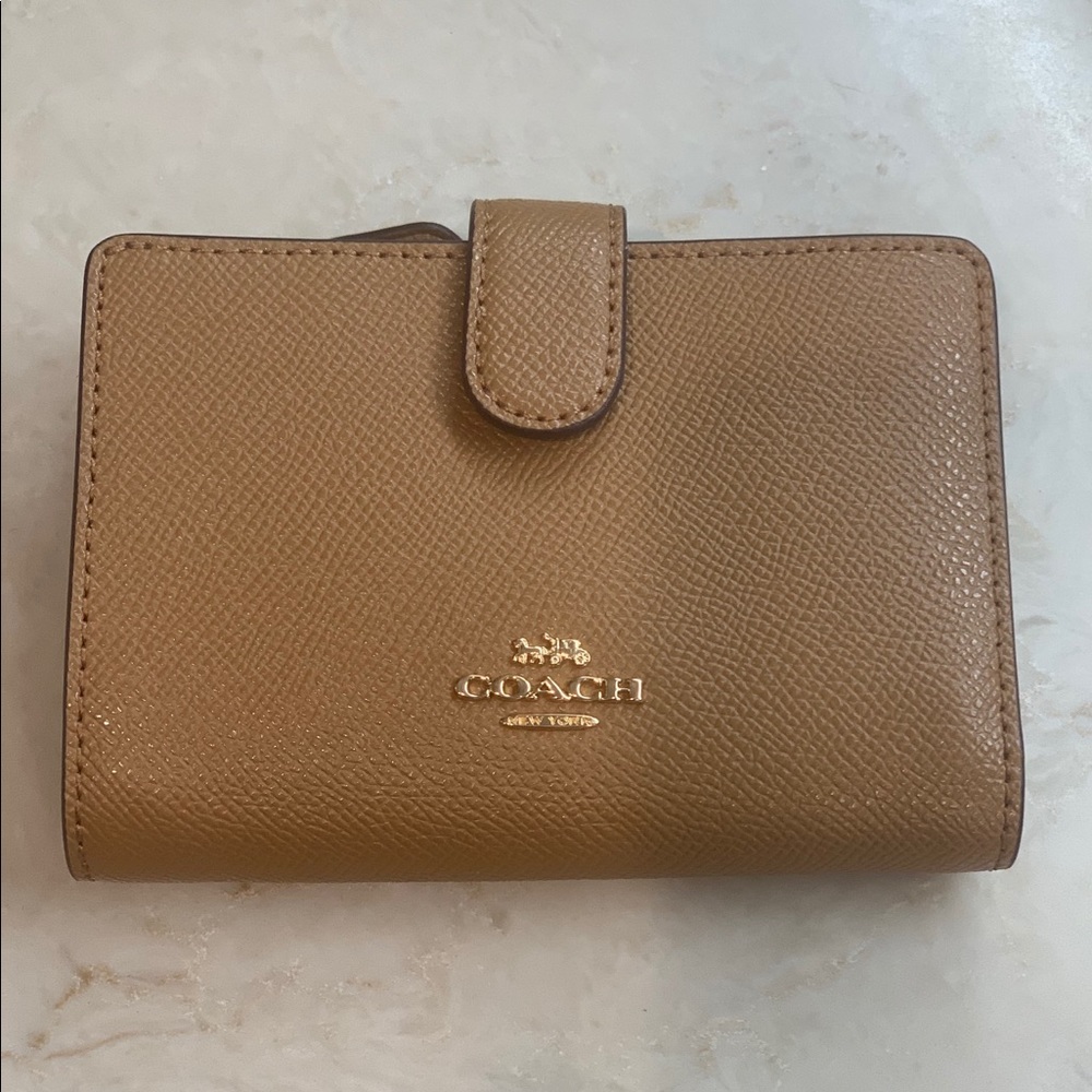 Coach medium corner zip wallet.  New with tags.